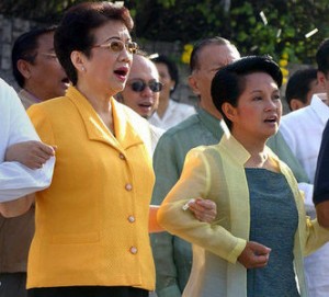 Song-and-dance: The late Cory Aquino with former President Gloria Arroyo