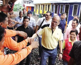 President BS Aquino takes time out for a photo-op while inspecting the controversial bunkhouses