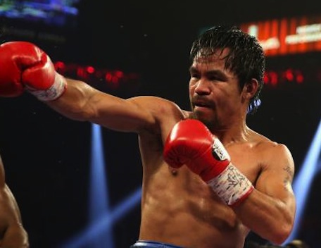 The 'better fighter': Manny Pacquiao won hearts by performing like the real deal.