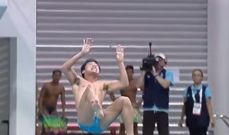 Filipino diver John David Pahoyo in the split-second before hitting the water