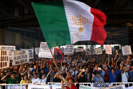 IGLESIA NI CRISTO AT EDSA-SHAW / AUGUST 29, 2015 IGLESIA PROTEST A protester waves the Iglesia ni Cristo banner during the INC rally at the Edsa-Shaw intersection to demand the resignation of Justice Secretary Leila de Lima, whom the sect accuses of meddling in its internal affairs by investigating charges of kidnapping and illegal detention filed by a former INC minister against the groupís leaders. INQUIRER PHOTO / NINO JESUS ORBETA