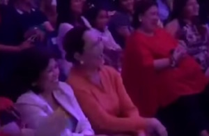 A member of the audience laughs heartily at Vice Ganda's objectionable jokes.